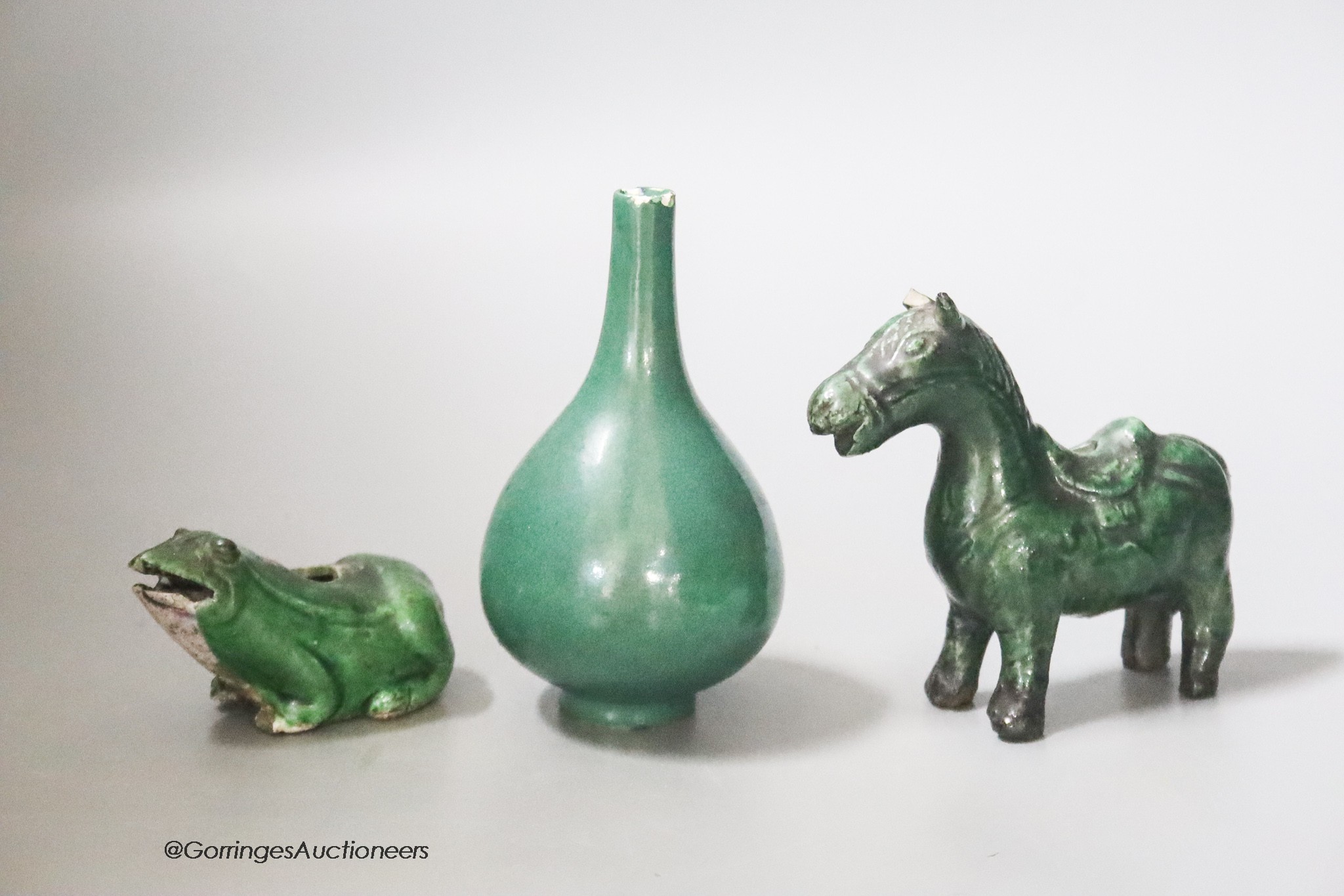 A Chinese green glazed miniature vase, 10cm, two green glazed water droppers in the form of a horse and a frog